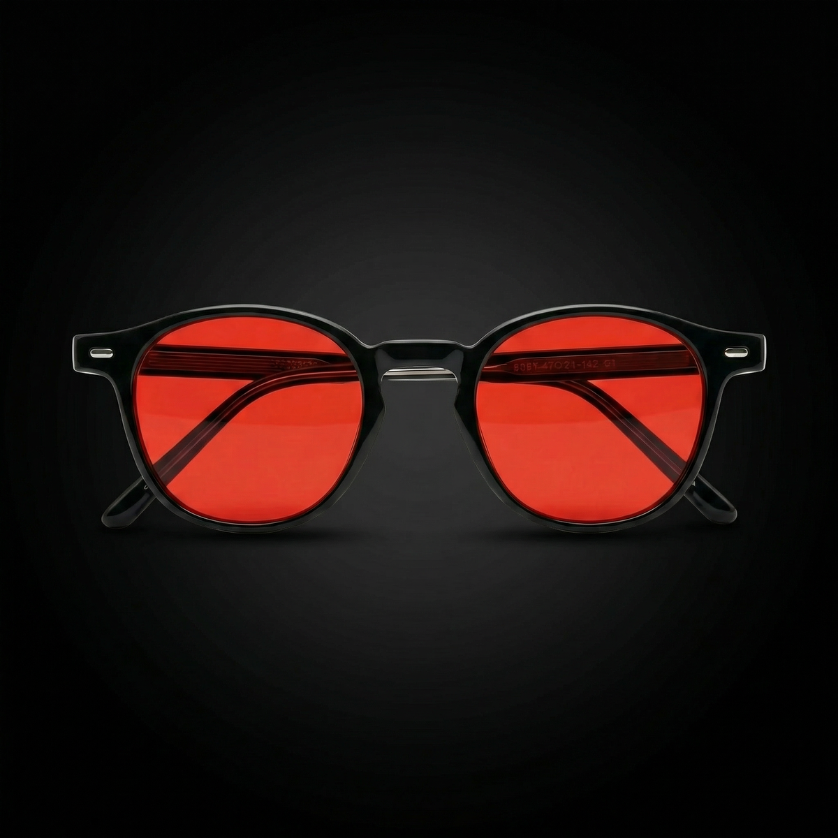 Gafas de filtro de luz azul Ceryon con lente roja sobre fondo oscuro